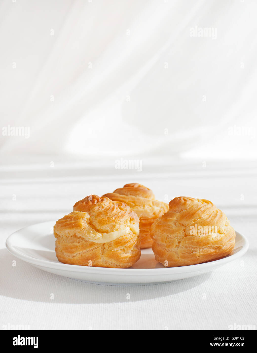 Profiteroles, choux with cream, anglaise dessert Stock Photo