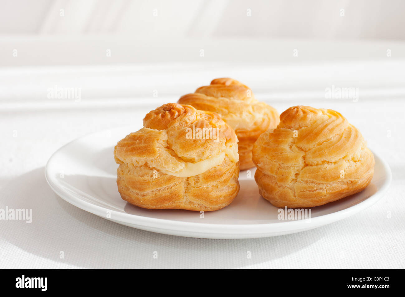 Profiteroles, choux with cream, anglaise dessert Stock Photo