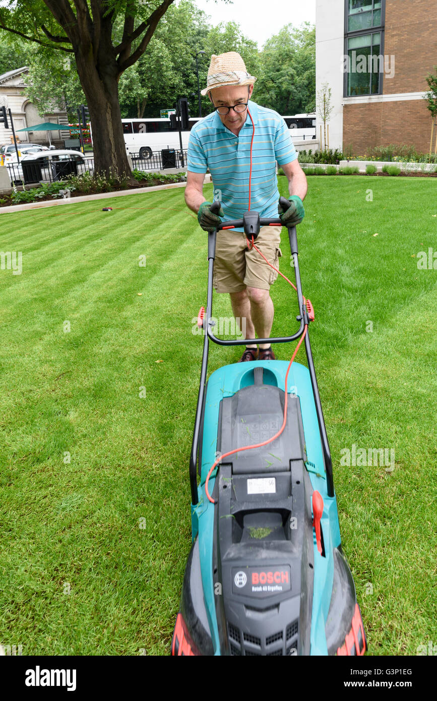 sexy man mowing the lawn