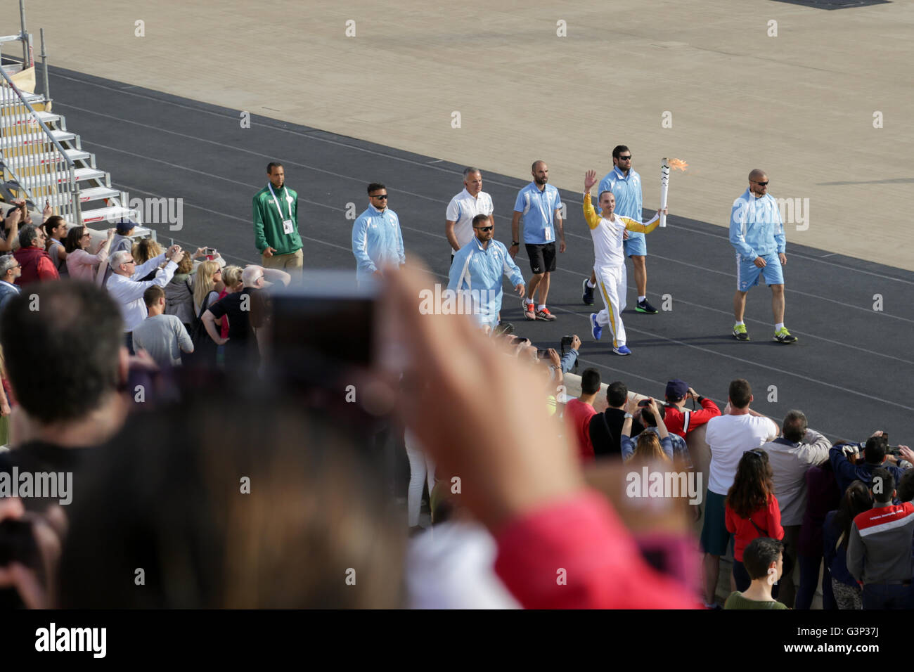 Athens, Greece. 27th Apr, 2016. Ioannis Melissanidis, the Olympic Winner as  he passes through the Panathenian Stadium to find the give the olympic  flame to the fourth bearer. © Panagiotis Limperopoulos/Pacific Press/Alamy