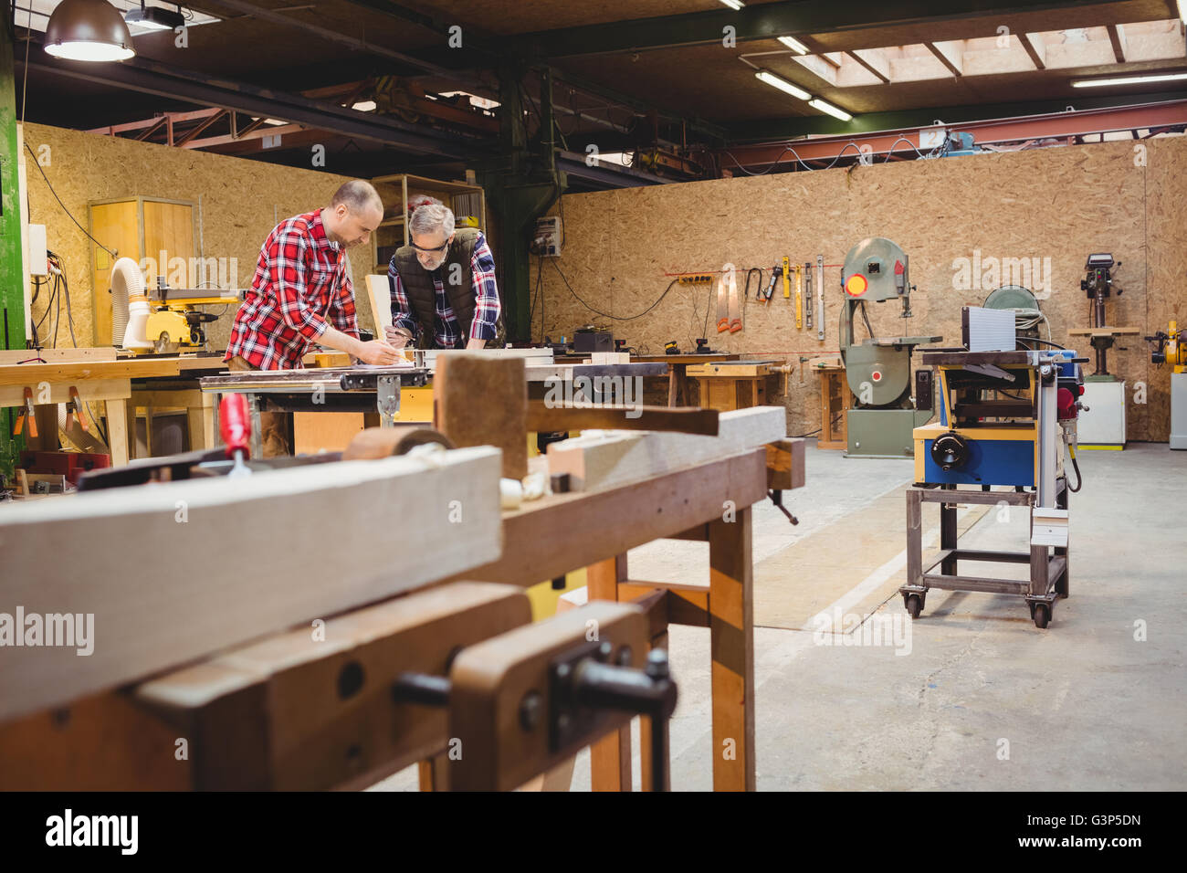 Carpenters reading a work plan Stock Photo Alamy