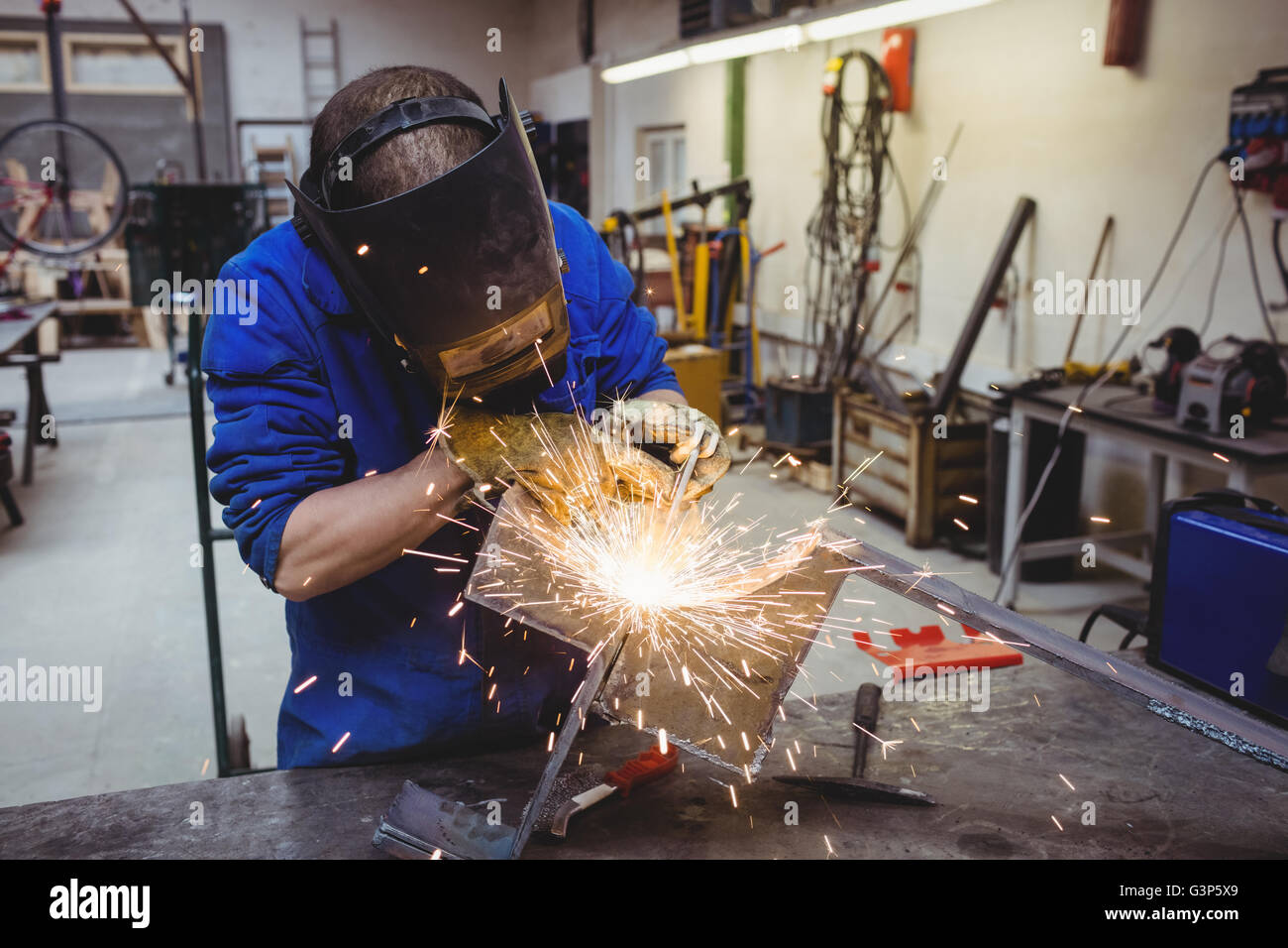 Welder cutting metal with grinder Stock Photo Alamy