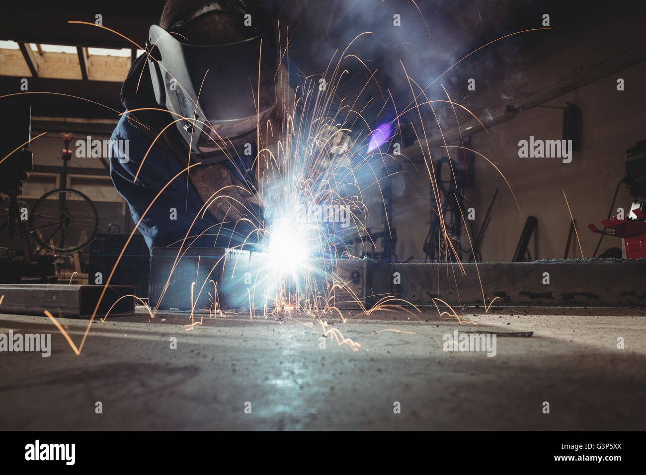 Welder cutting metal with grinder Stock Photo Alamy