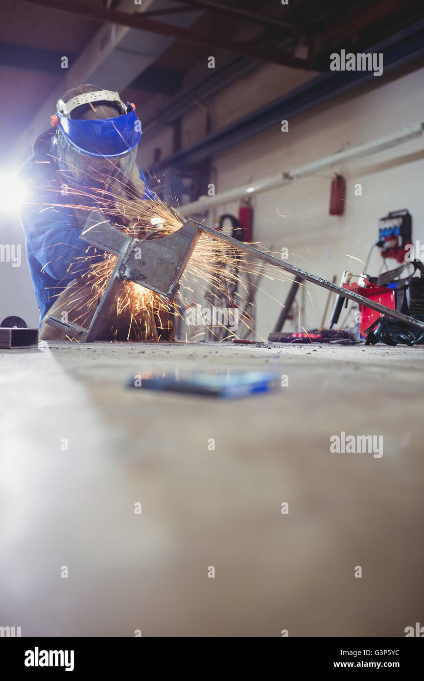 Welder cutting metal with grinder Stock Photo Alamy