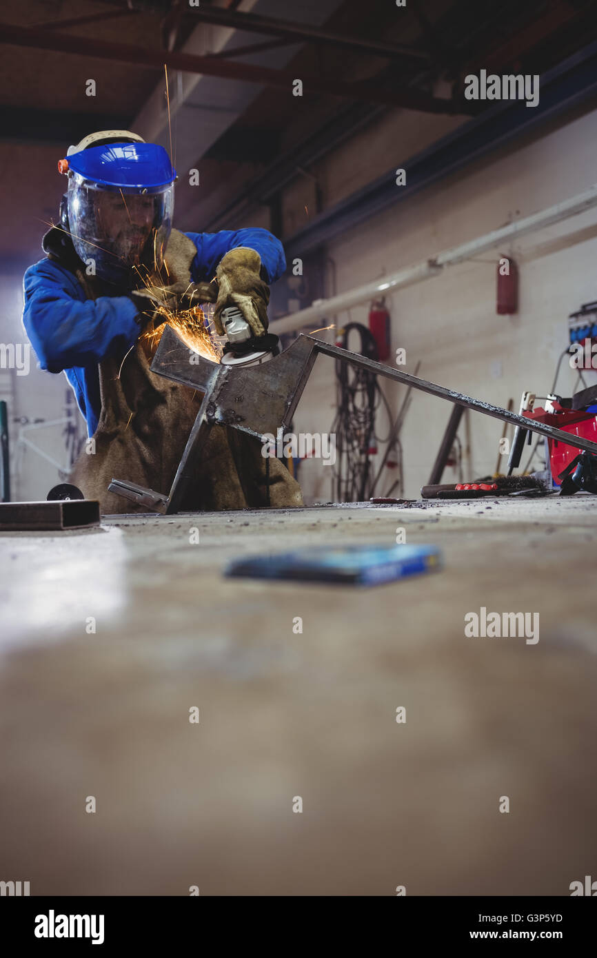 Welder cutting metal with grinder Stock Photo Alamy