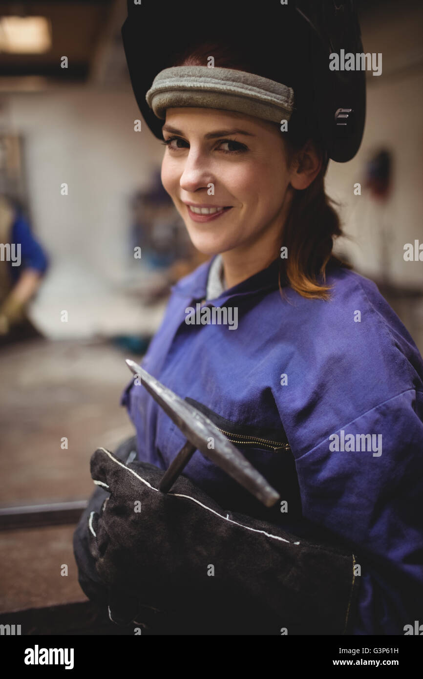 Smiling female welder in protective workwear Stock Photo Alamy