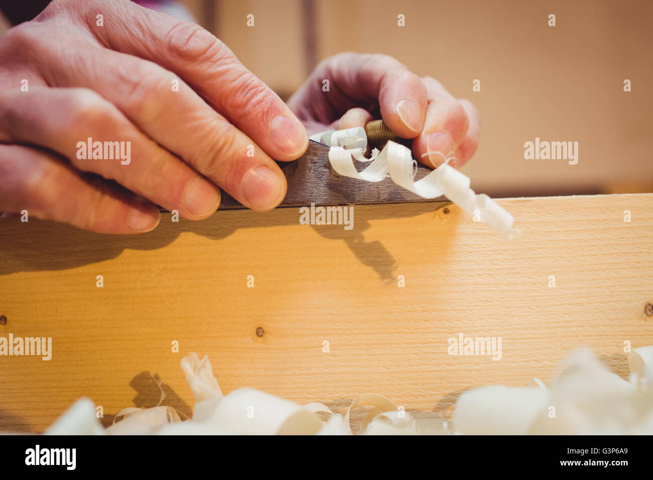 Close-up of wood shavings being pulled out Stock Photo