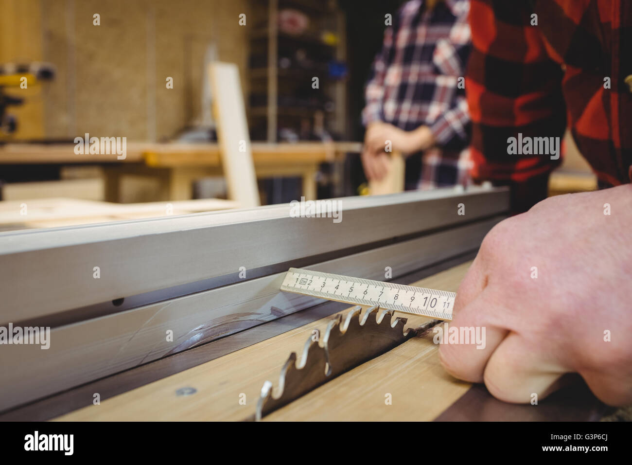 Carpenter measuring wood plank Stock Photo Alamy
