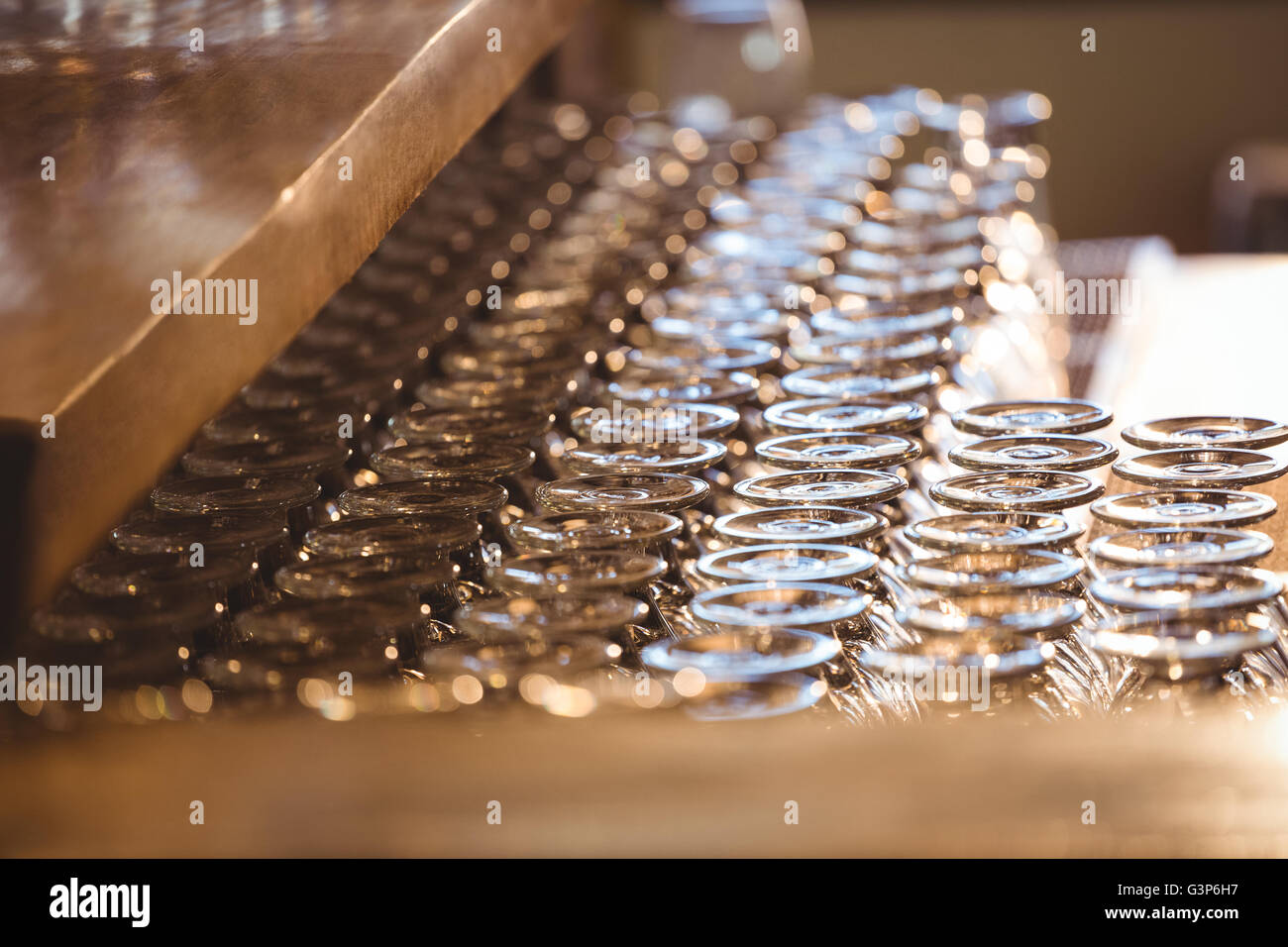 Empty wine glasses arranged on bar counter Stock Photo