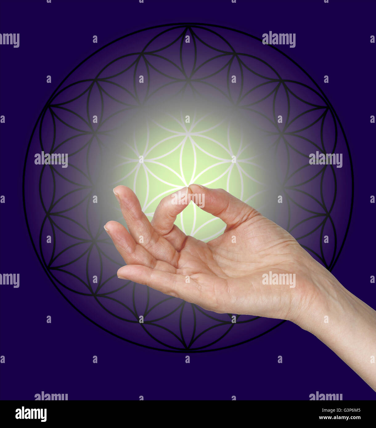 female hand making Gyan Mudra hand position with the Flower of Life symbol in background and pale lemon glow surrounded by blue Stock Photo