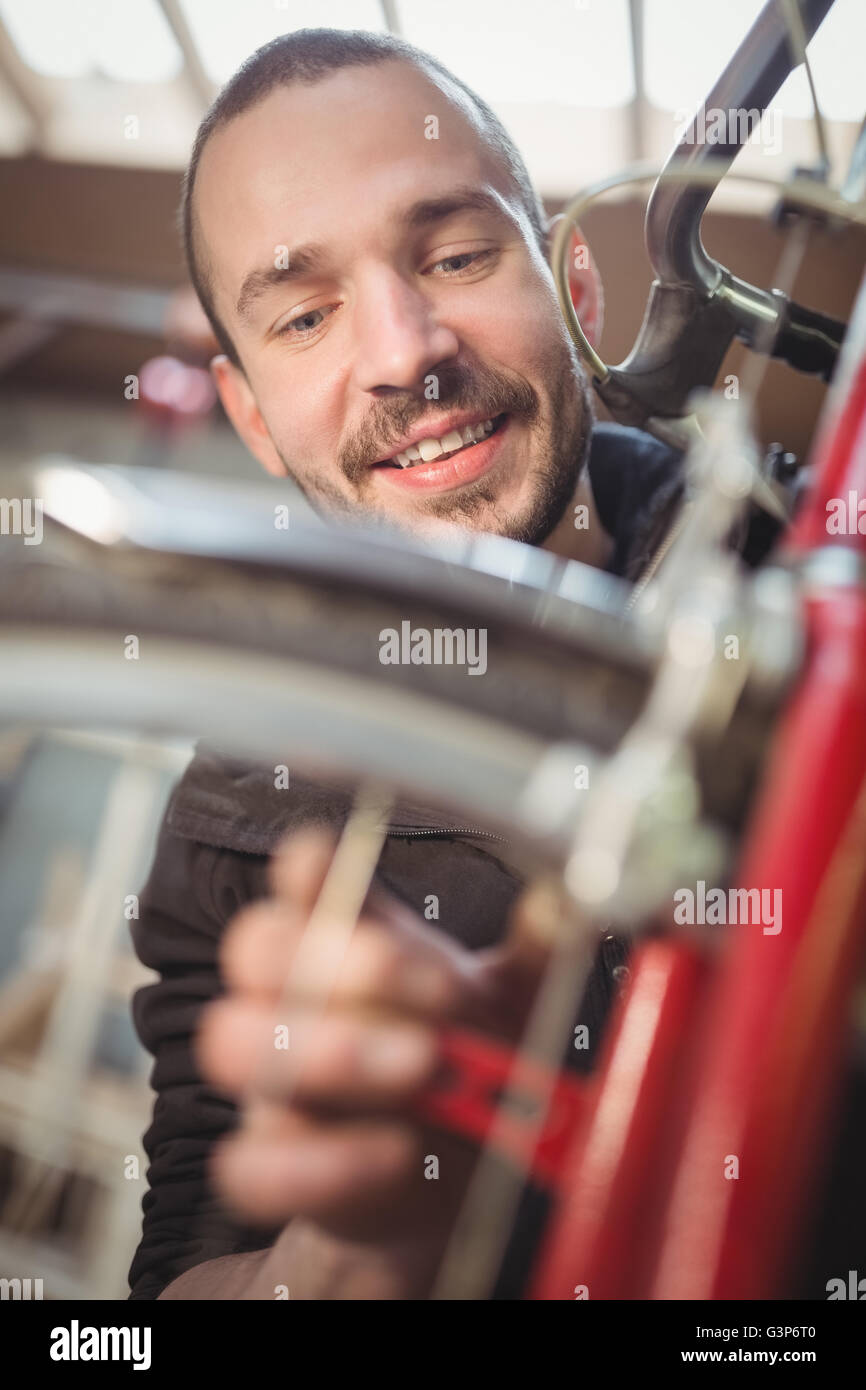 Mechanic repairing a bicycle Stock Photo
