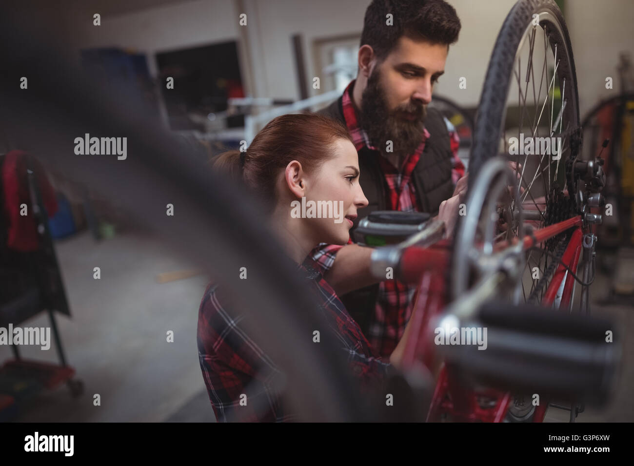 Mechanics repairing a bicycle Stock Photo Alamy