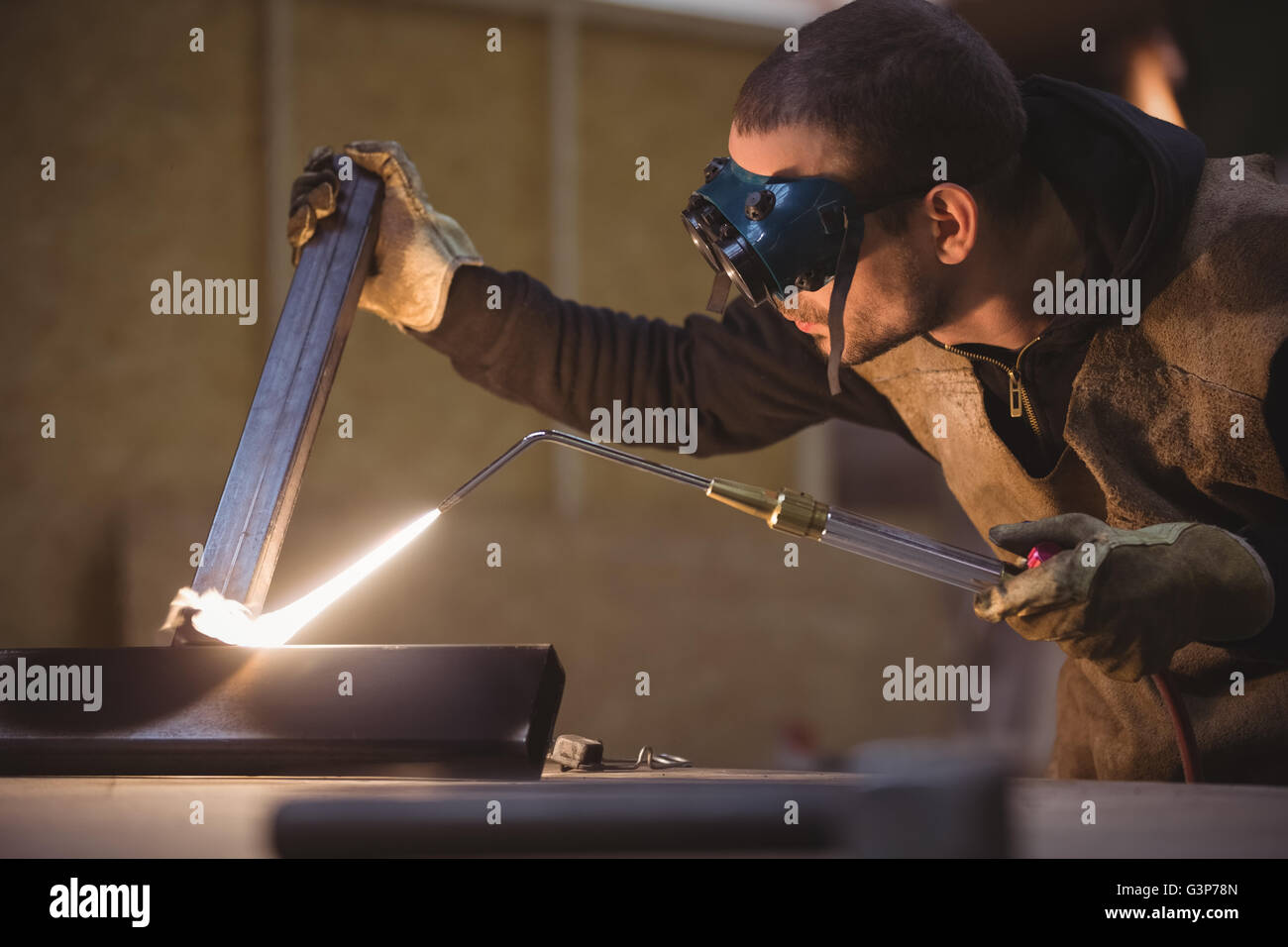 Welder welding a metal Stock Photo
