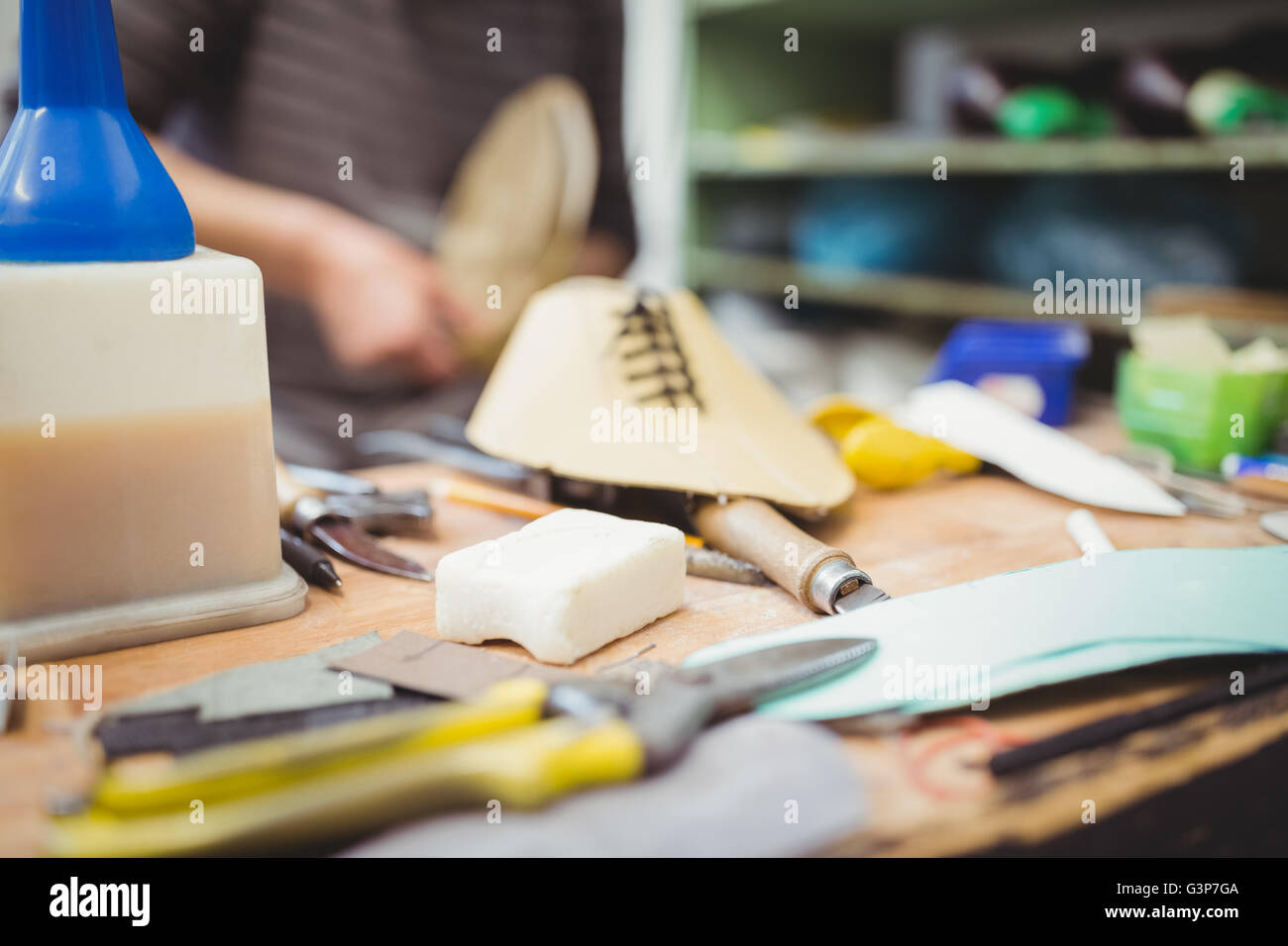 Shoe and tools in table Stock Photo