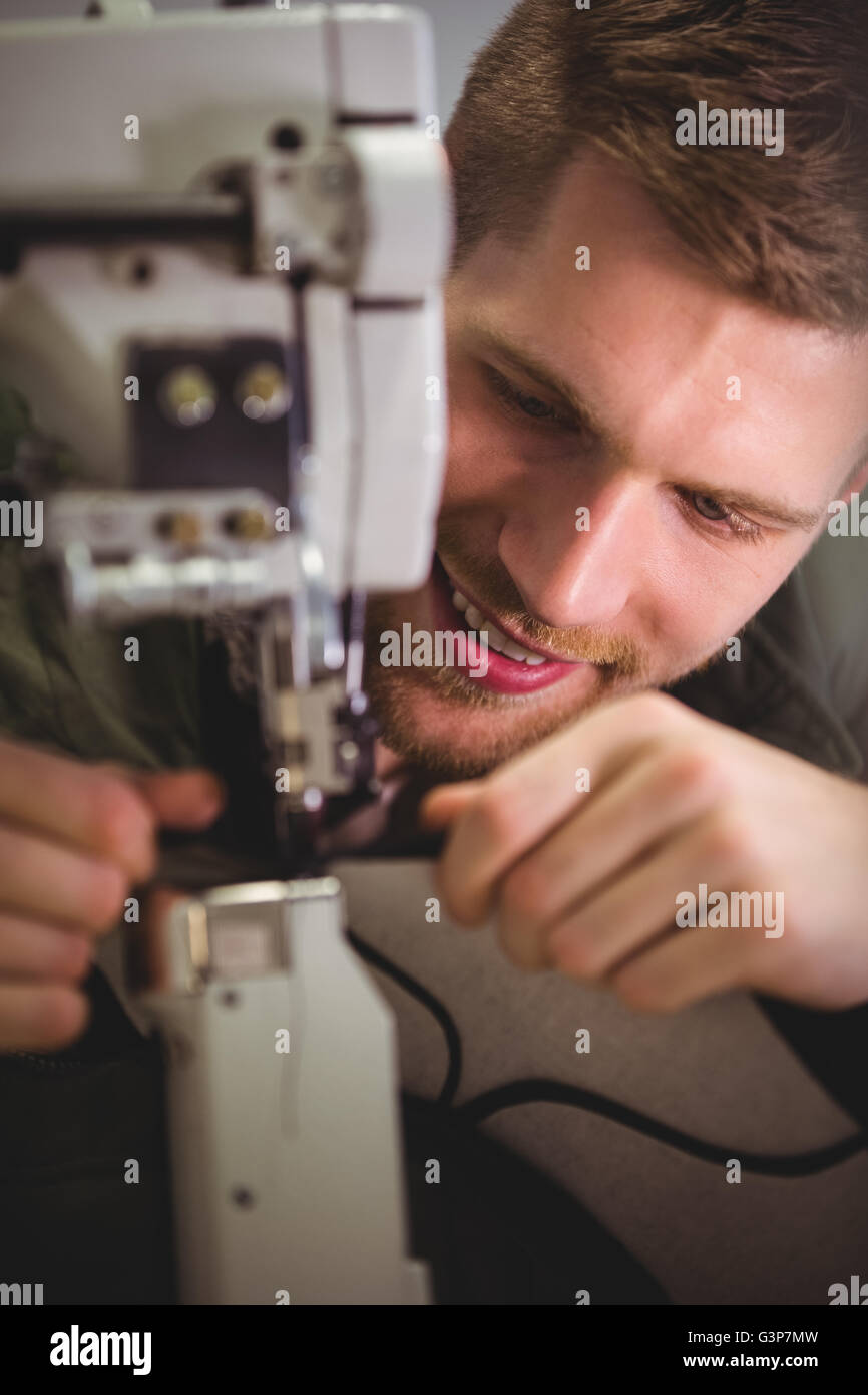 Cobbler using sewing machine Stock Photo Alamy