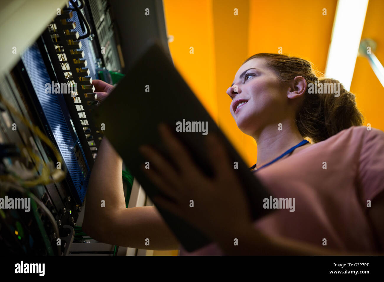 Technician working on broken server Stock Photo