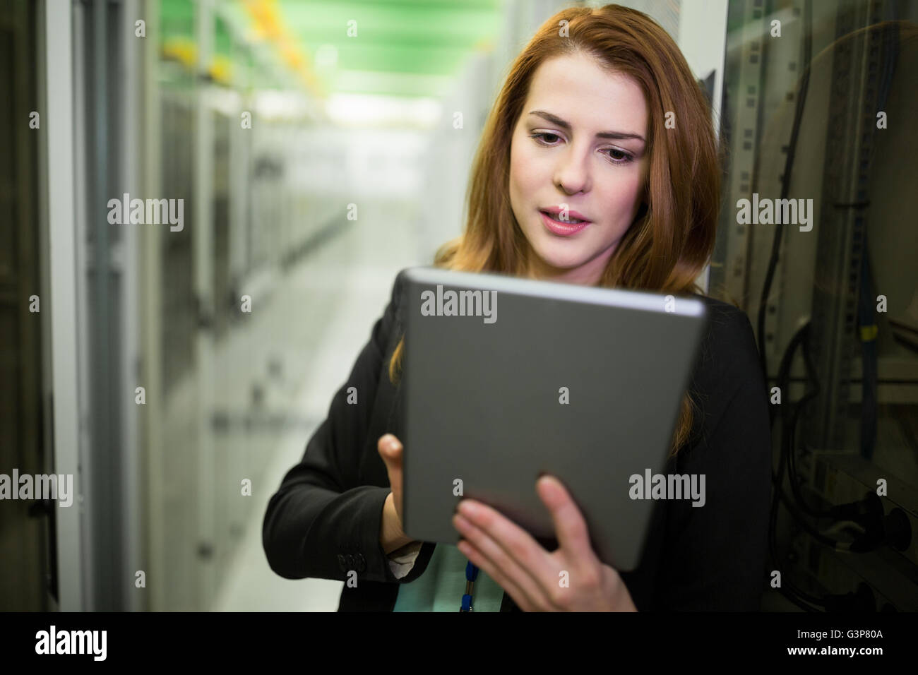 Technician using digital tablet Stock Photo