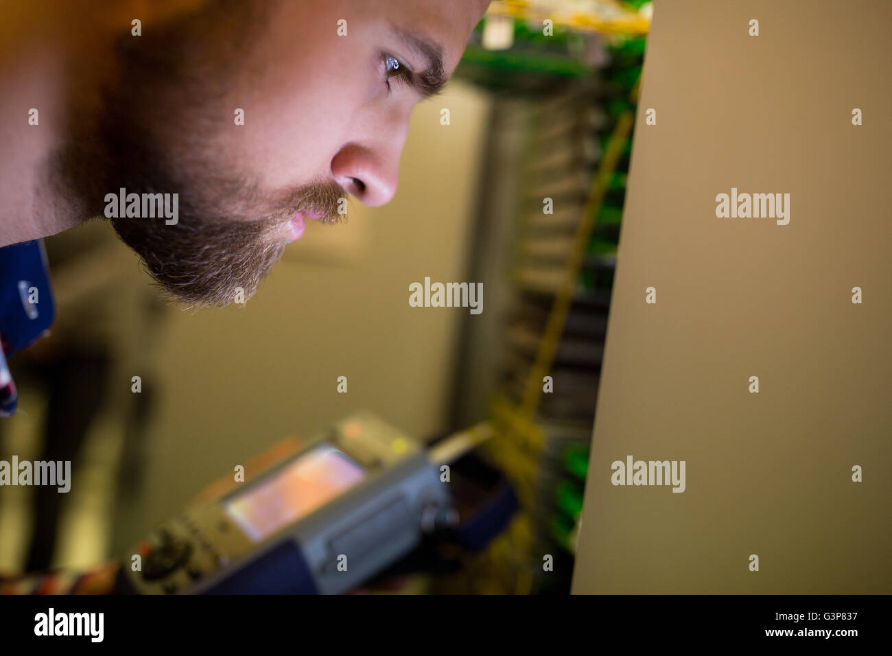Technician using digital cable analyzer Stock Photo