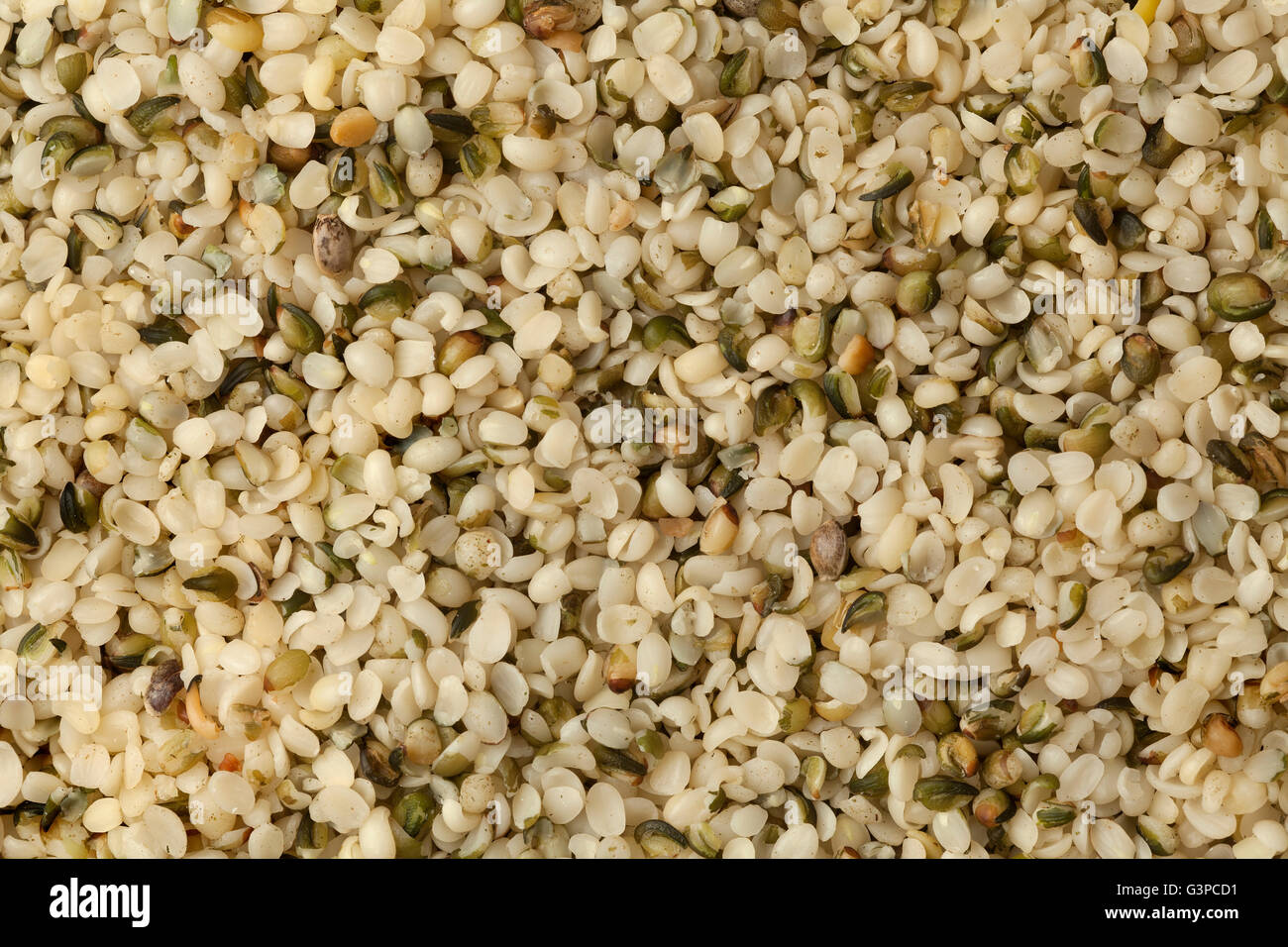 Heap of raw peeled hemp seeds full frame Stock Photo