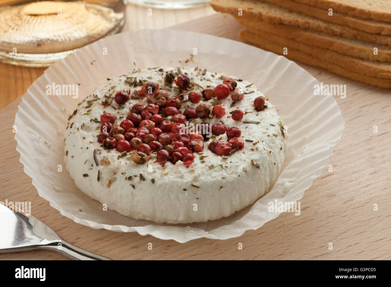 Traditional French goats cheese with pink pepper Stock Photo