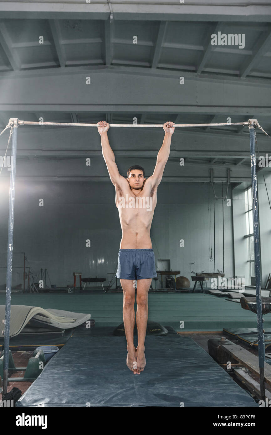 Male gymnast performing handstand on parallel bars Stock Photo Alamy