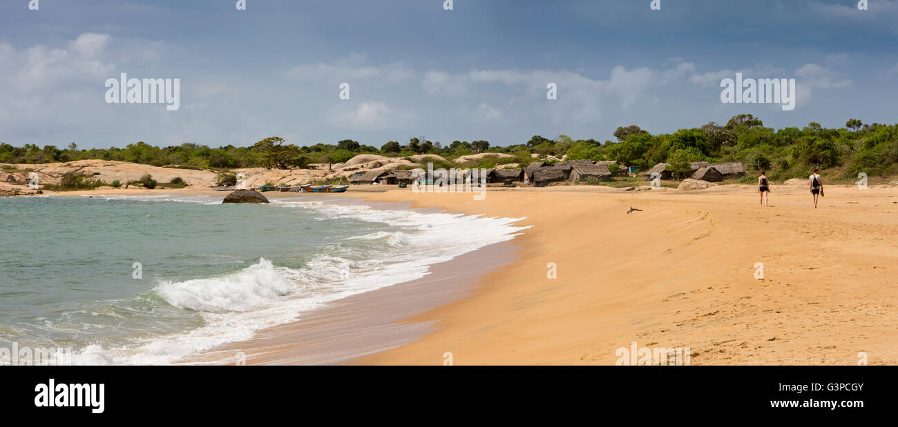 Sri Lanka, Yala National Park, Palatupana beach, tourists walking to fishing village, panoramic Stock Photo