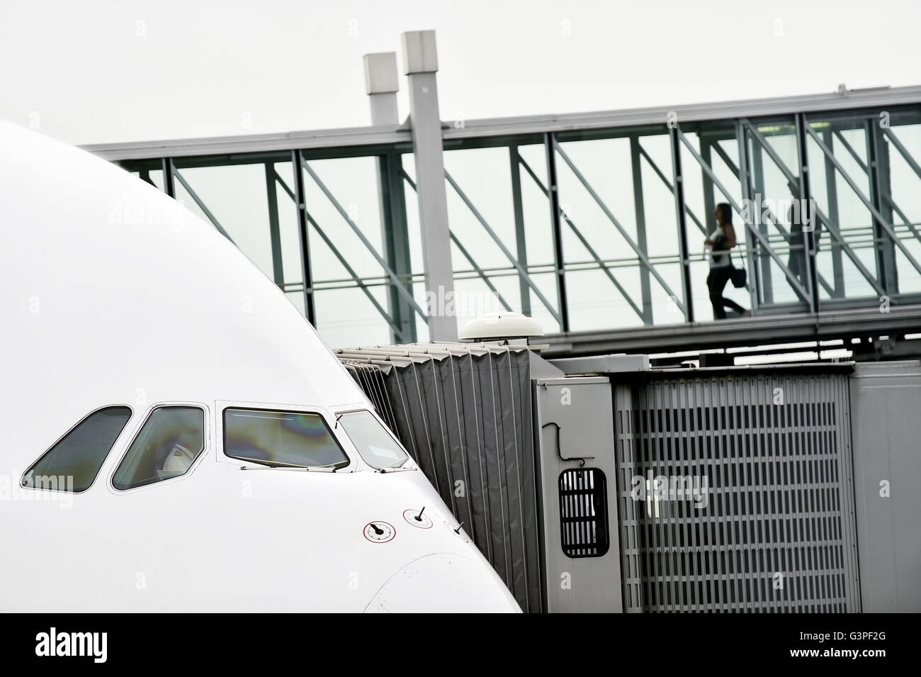 Unrecognizable people boarding into big airplane Stock Photo