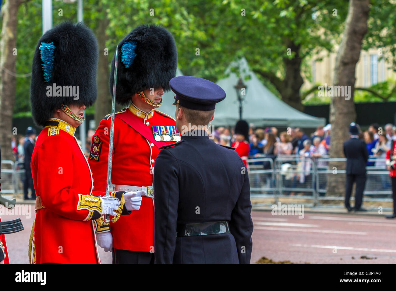 Officers of The Irish Guards talking with a soldier at The Queens Birthday Parade also known as The Trooping Of The Colour, The Mall , London Stock Photo