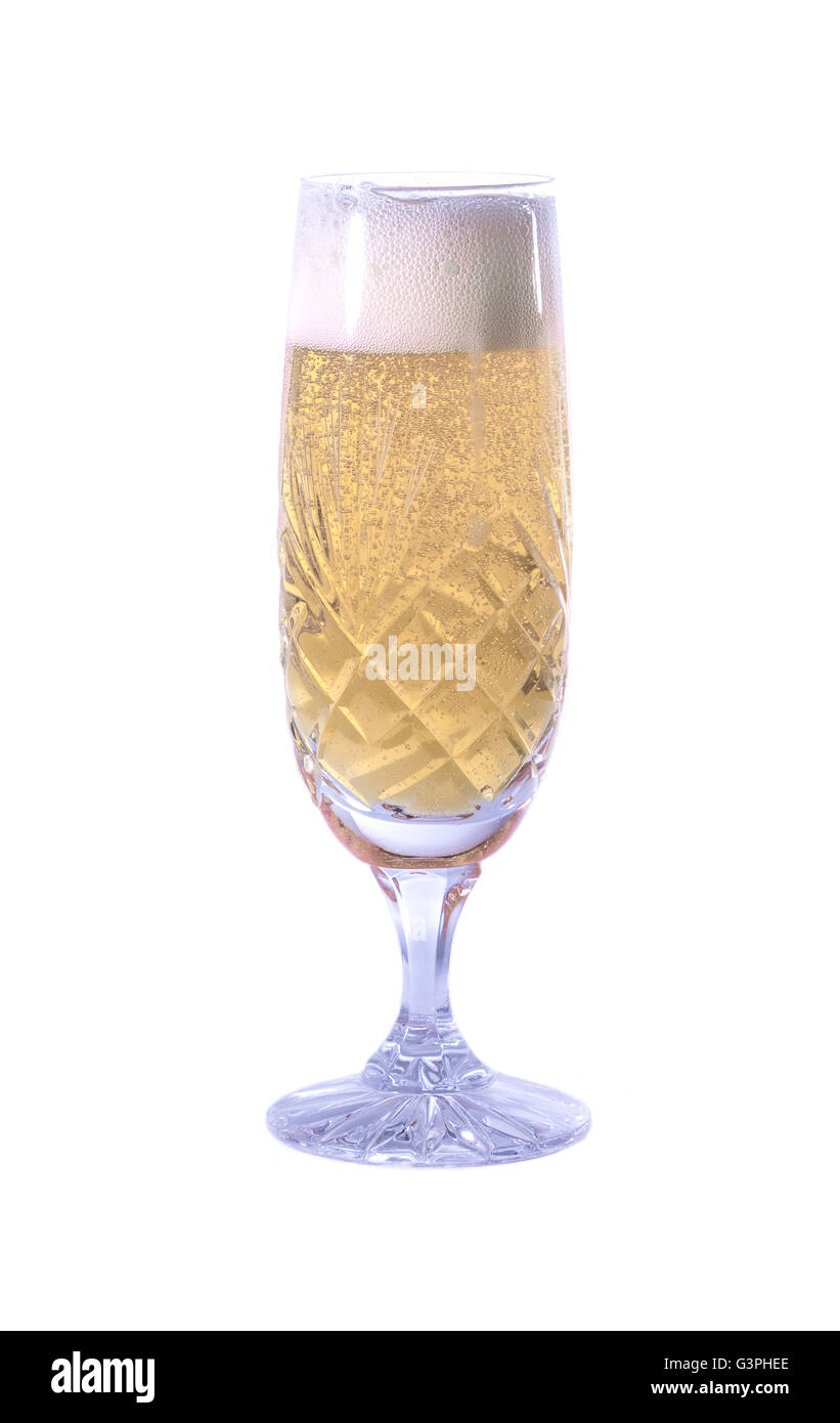 Champagne fizzing in a glass Stock Photo