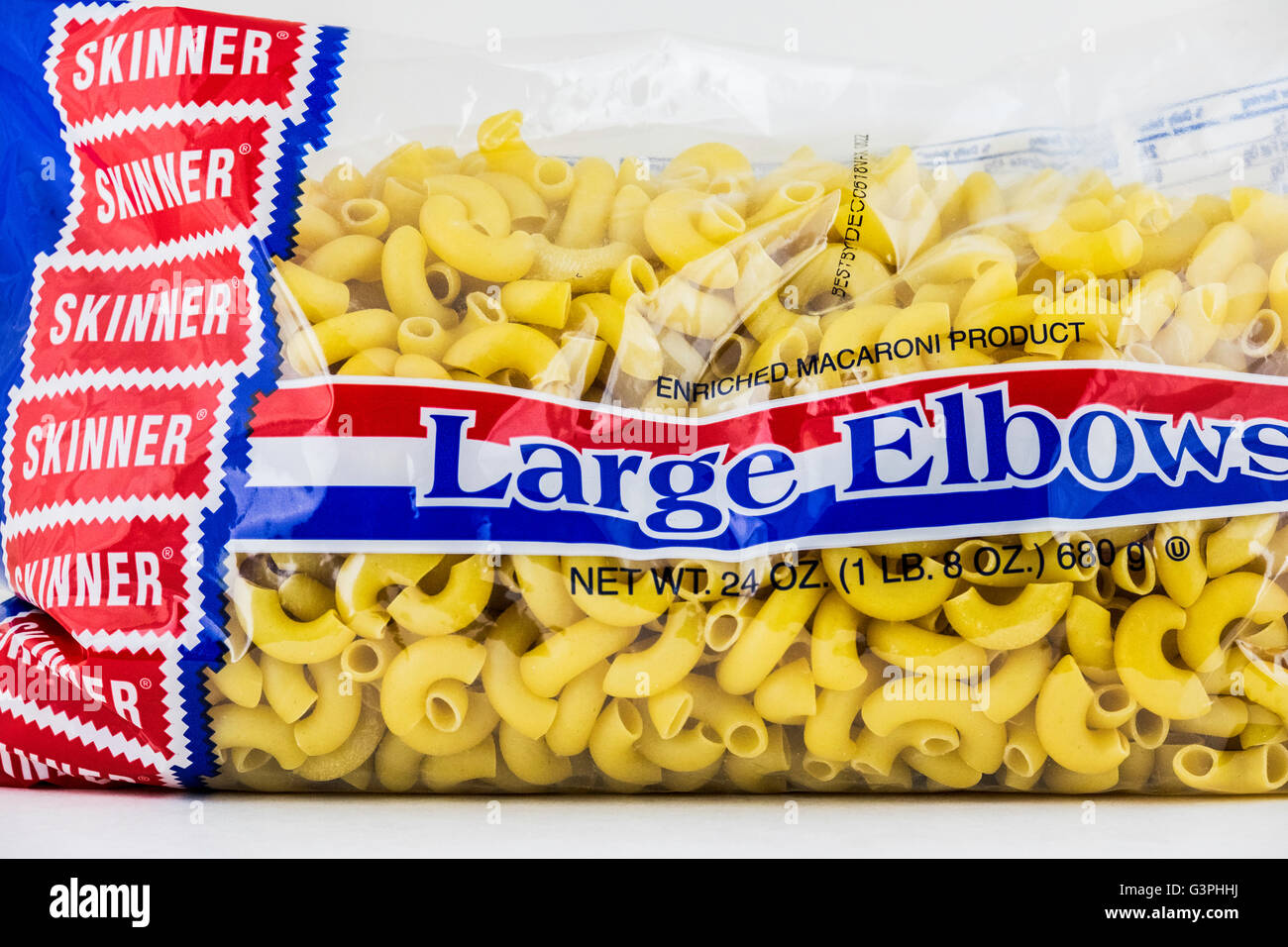 A 24 oz package of Skinner Large Elbows macaroni. USA. On white