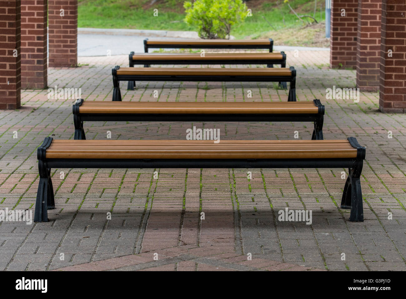 Benches At A Bus Stop Under A Brick Pavilion Stock Photo