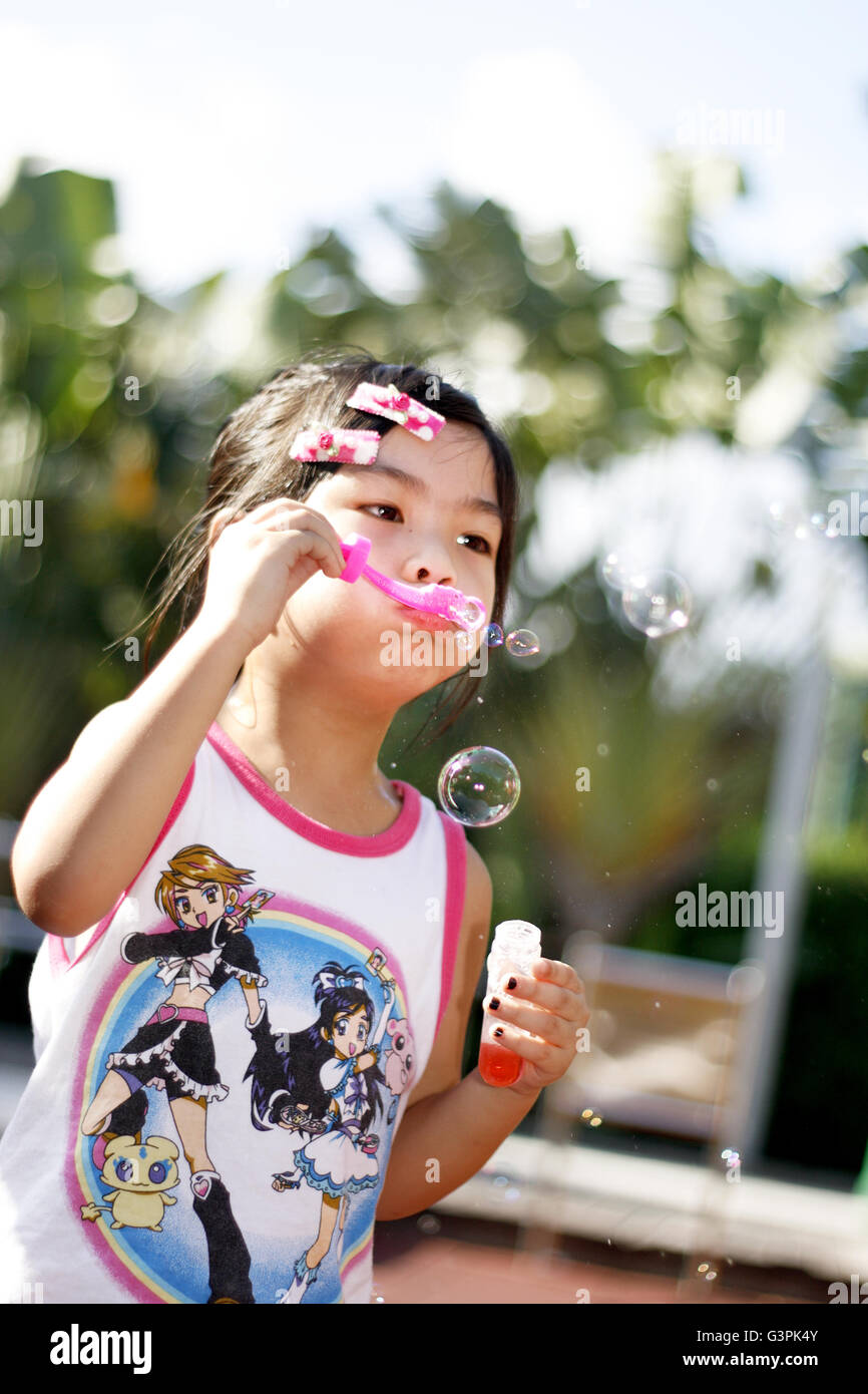 Chinese girl playing in  the playground Stock Photo
