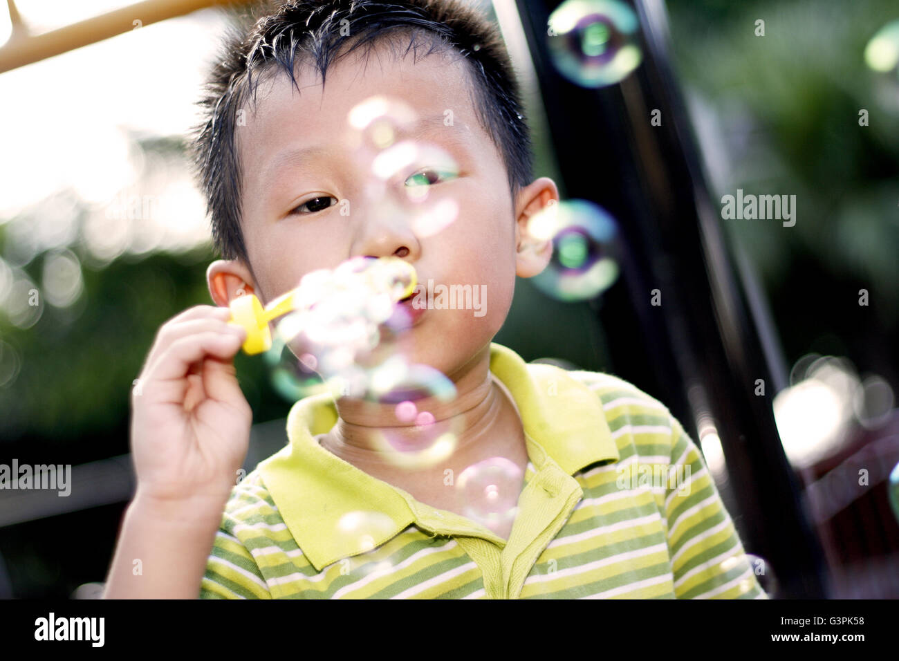 Chinese boy playing in the playground Stock Photo