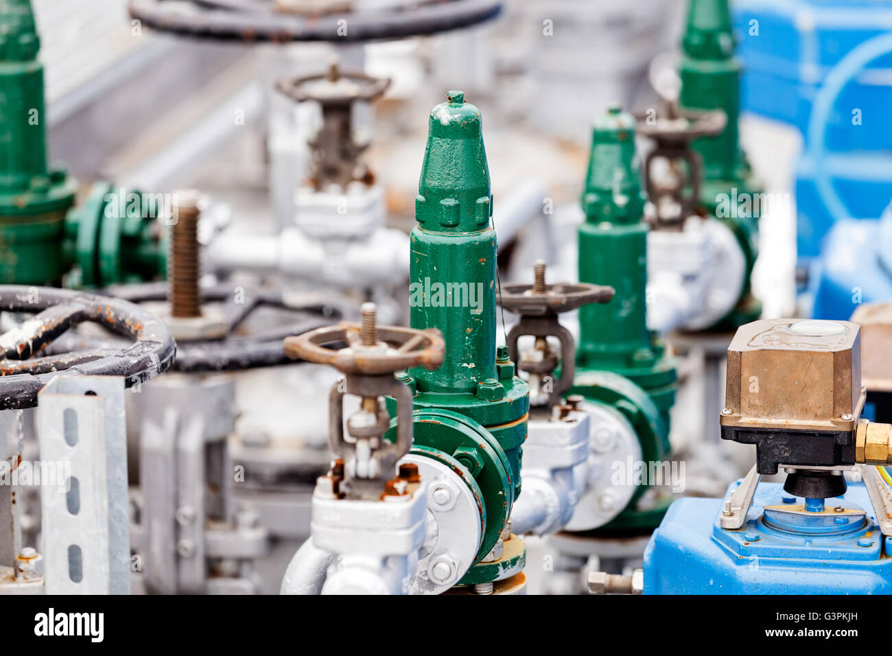 Valves In Refinery detail of oil pipeline with valves in large oil refinery Stock Photo ...