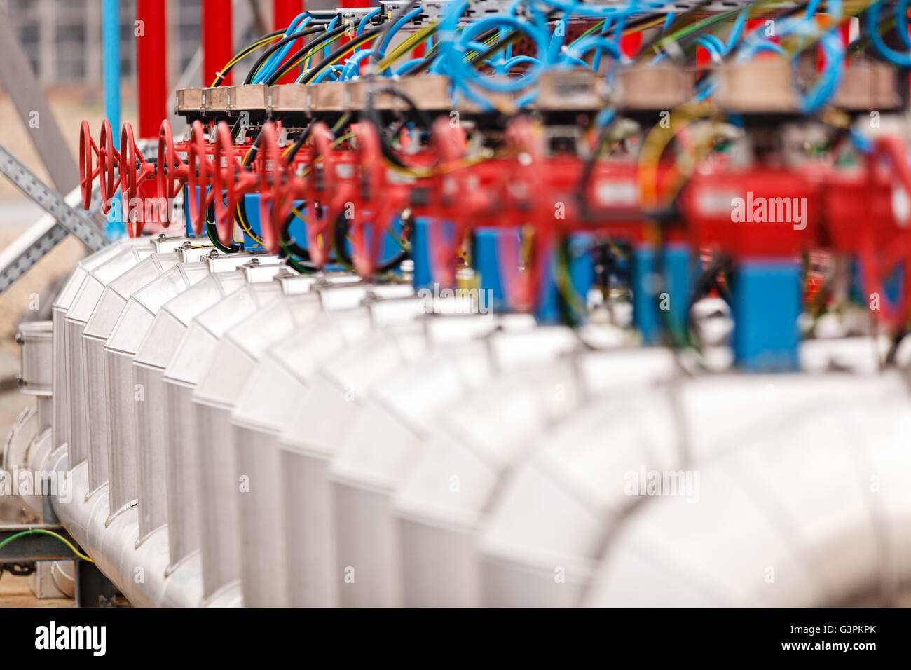 detail of oil pipeline with valves in large oil refinery Stock Photo