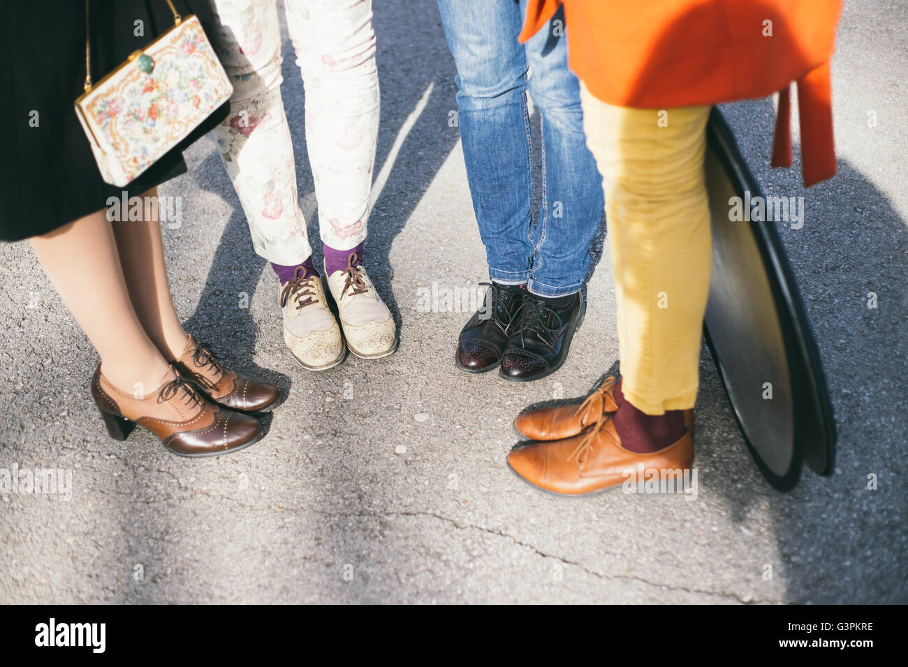 Four women wearing similar shoes Stock Photo Alamy