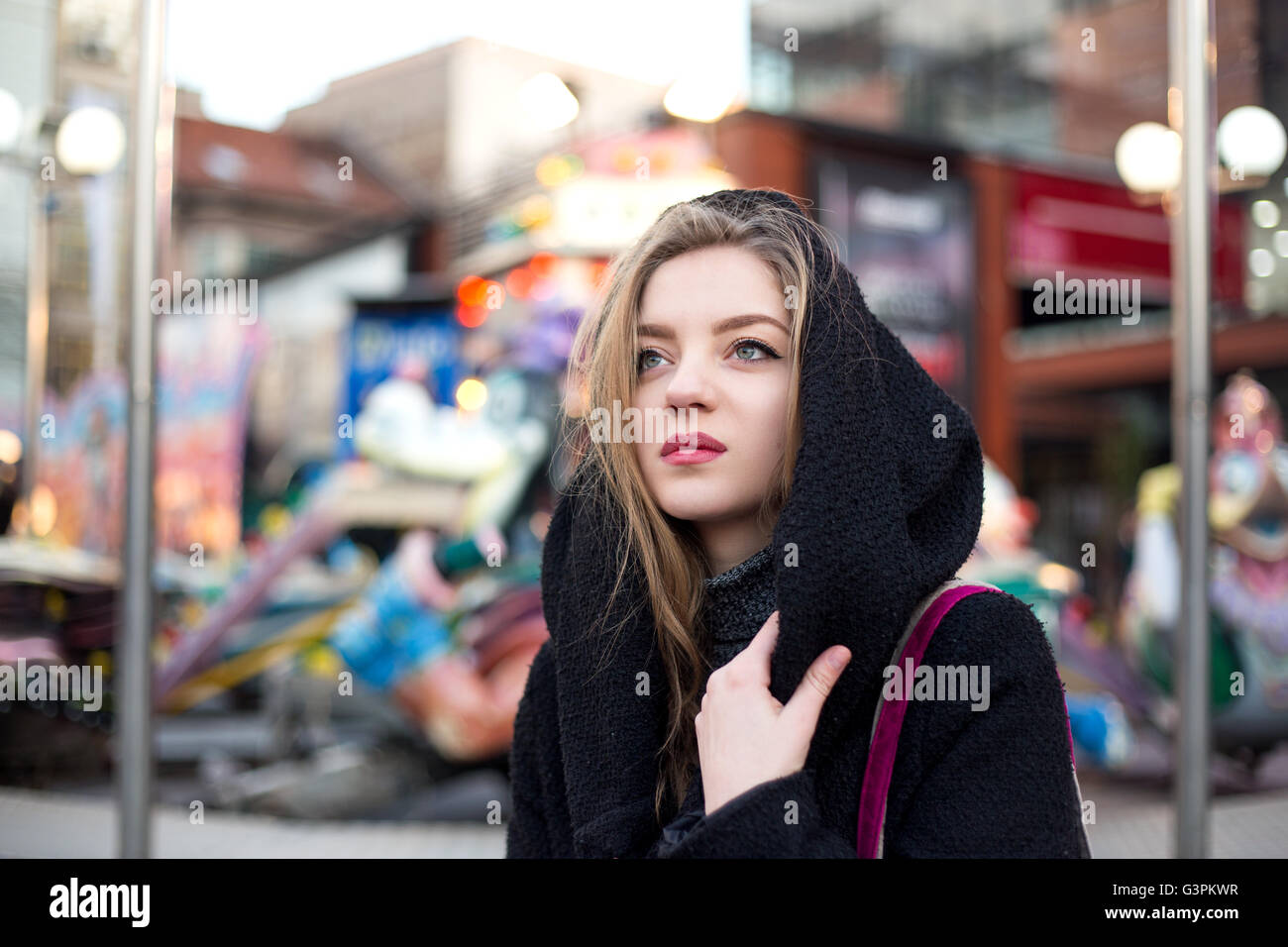 Woman in black coat hi-res stock photography and images - Alamy
