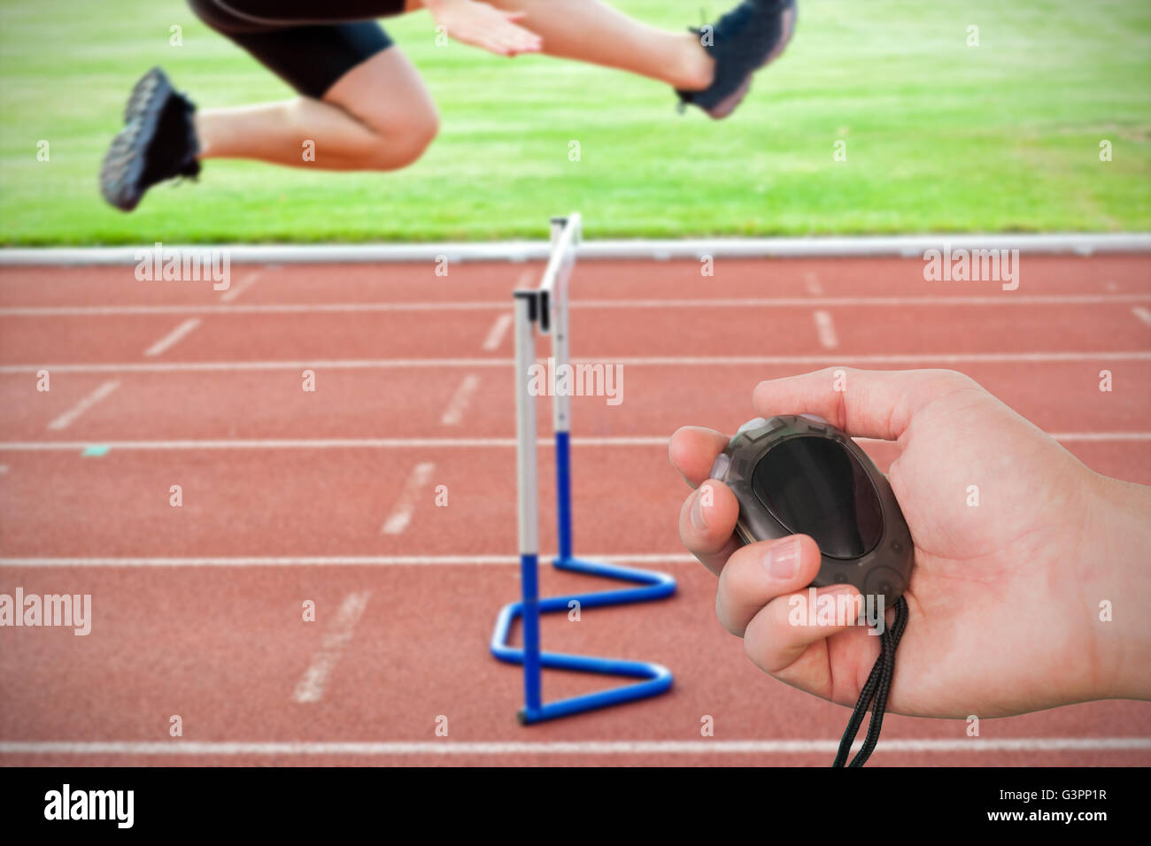 Composite image of coach is holding a stopwatch against assertive male