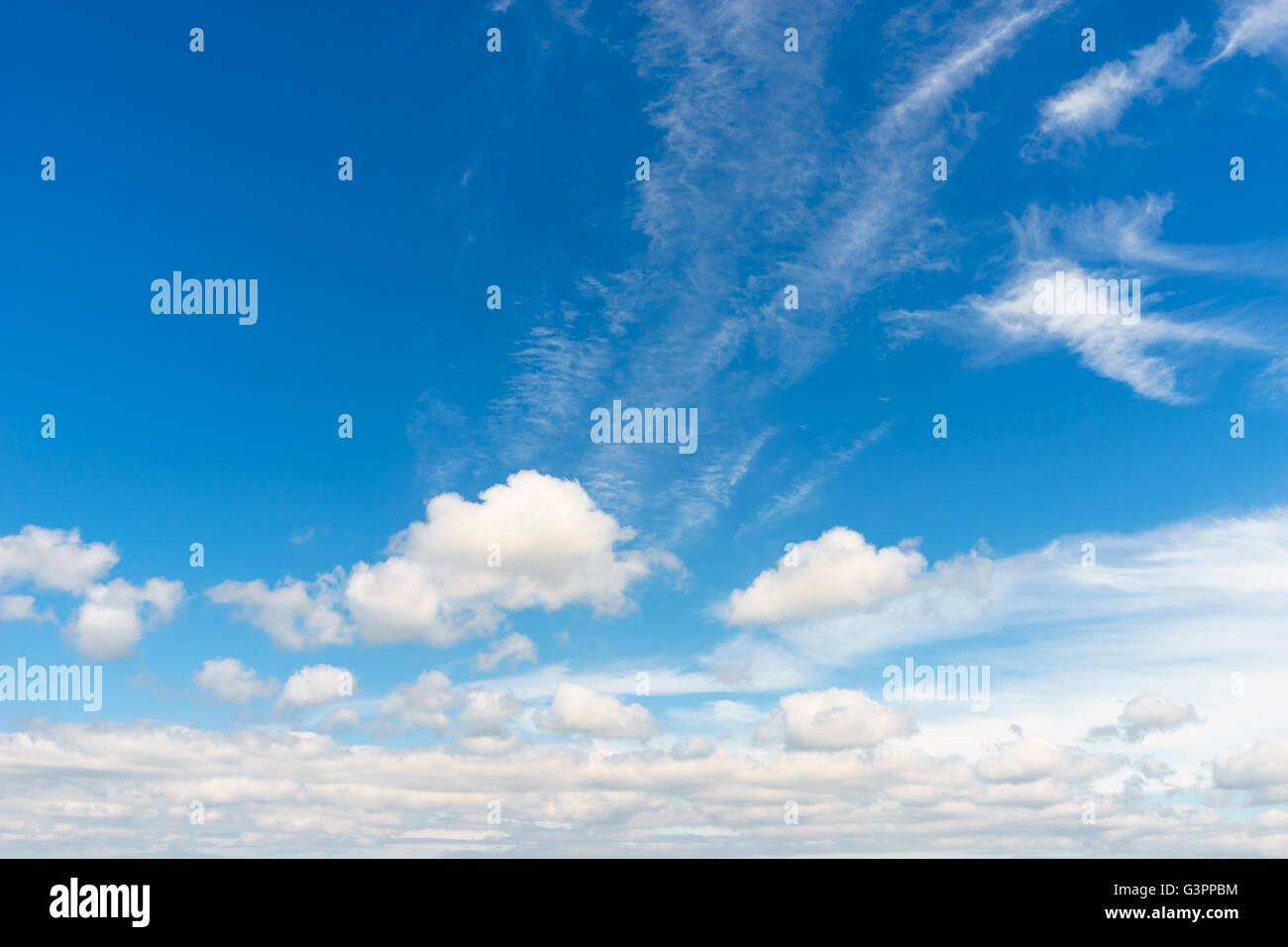 Different type of clouds covering deep blue sky Stock Photo - Alamy
