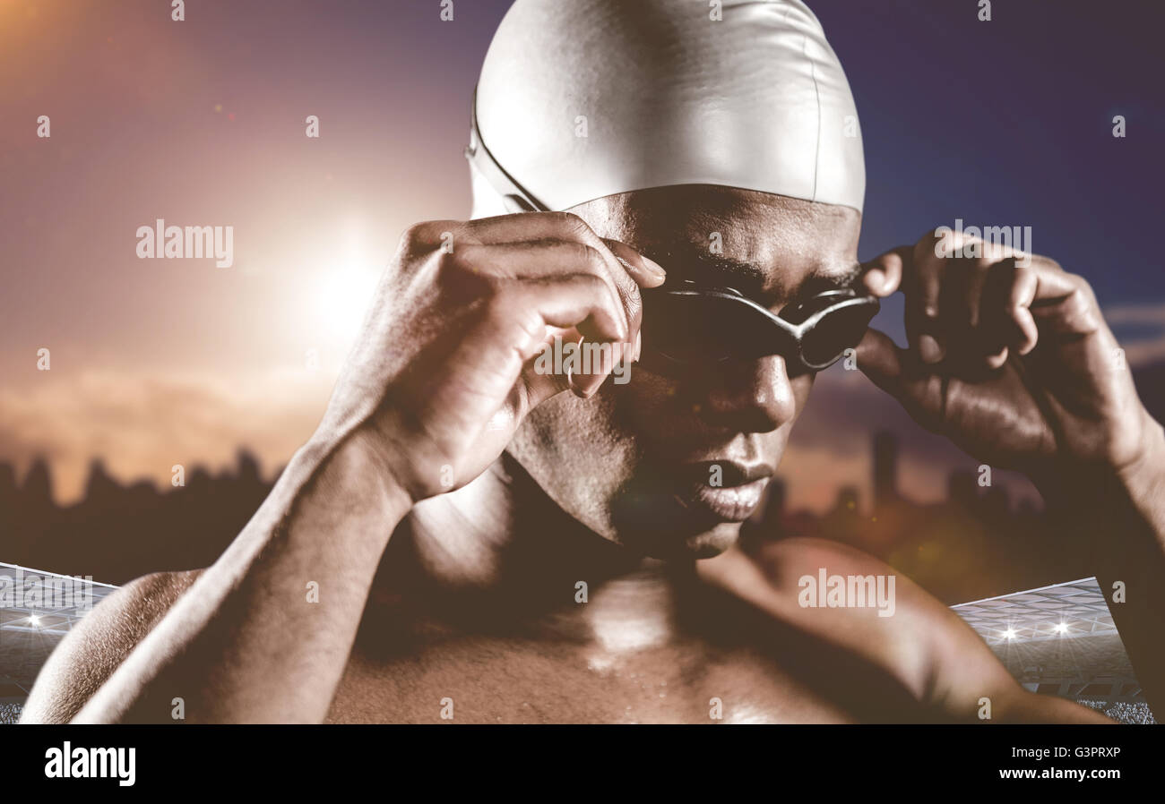 Composite image of swimmer ready to dive Stock Photo