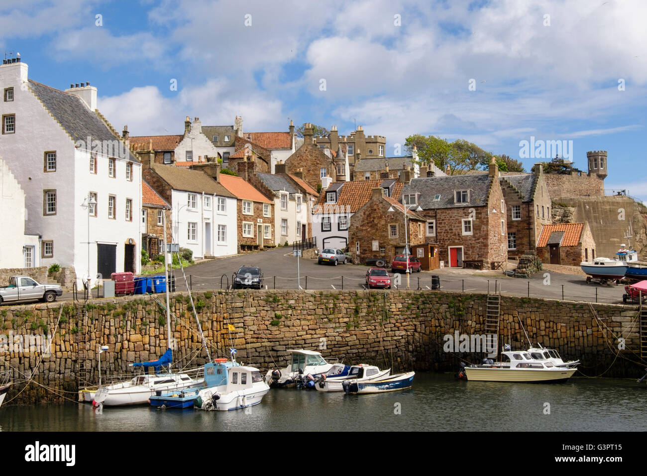 Old fishermen's cottages around harbour with moored fishing boats in old village on Firth of Forth coast. Crail, East Neuk of Fife, Fife, Scotland, UK Stock Photo