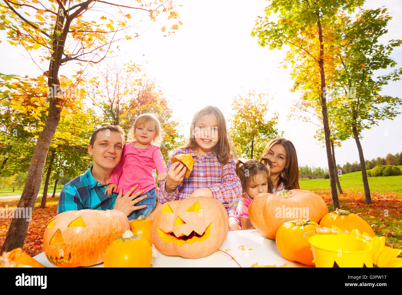 Girls with parents get ready for Halloween Stock Photo