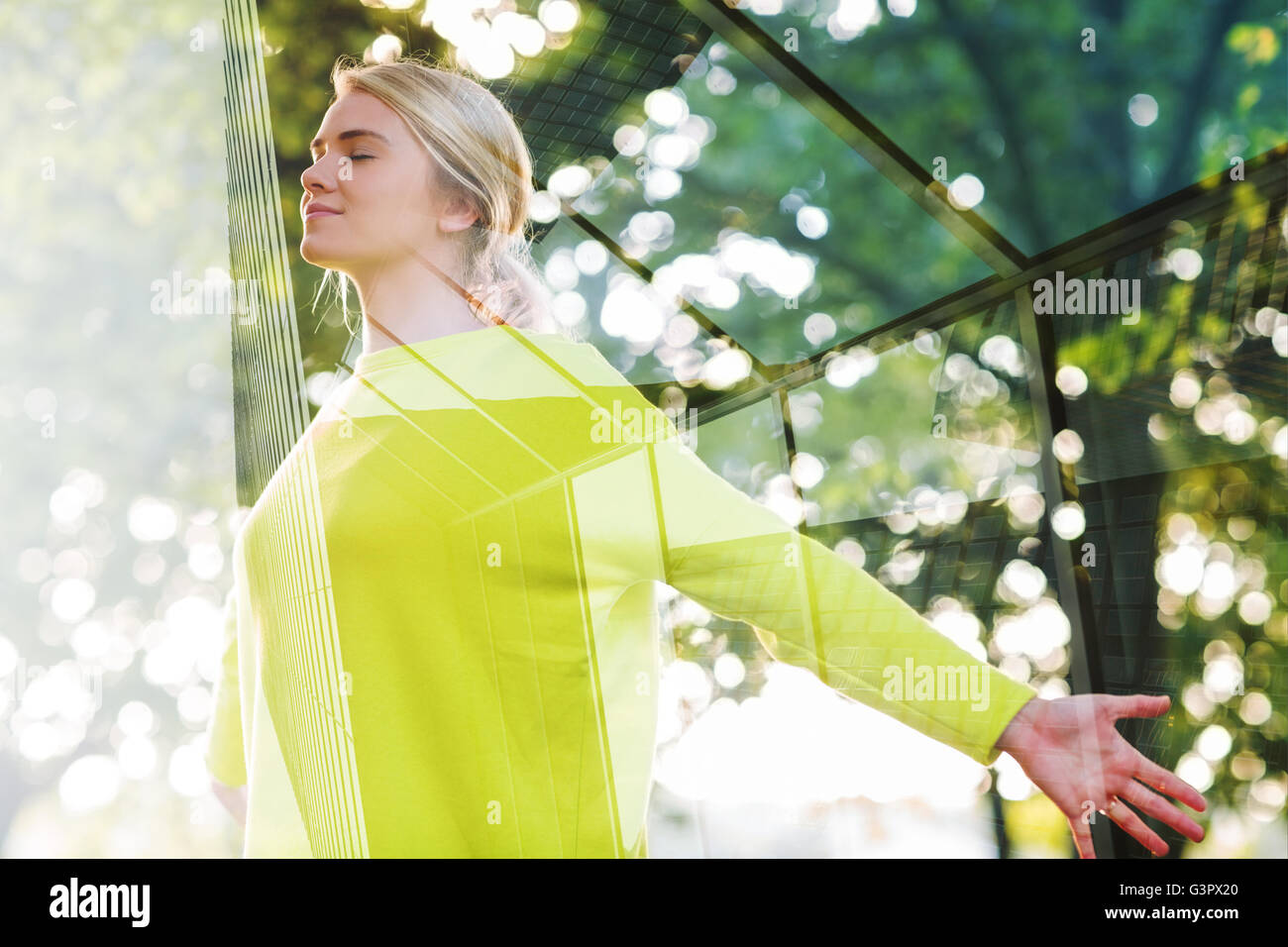 Composite image of fit happy blonde enjoying the sun Stock Photo