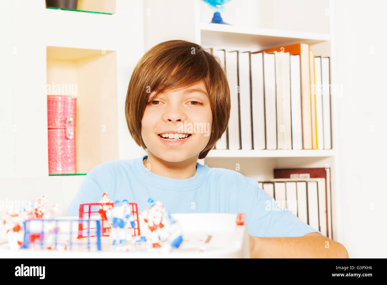 Happy kid boy playing ice hockey table board game Stock Photo Alamy