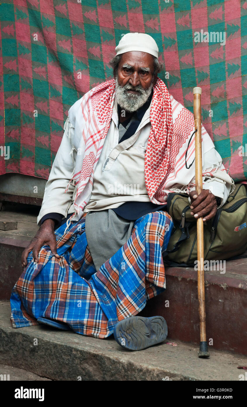 Indian man sitting on steps hi-res stock photography and images - Alamy