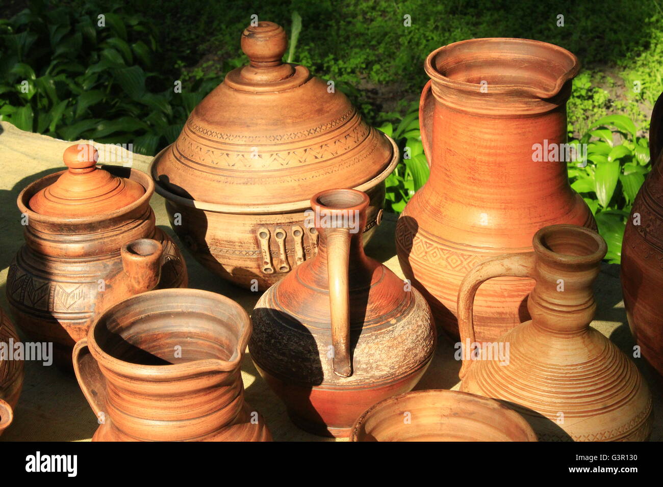 ceramic handmade brown earthenware like pots and carafe on sale Stock Photo