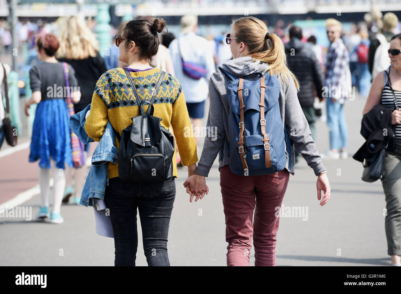 Two women hand in hand hi-res stock photography and images - Alamy