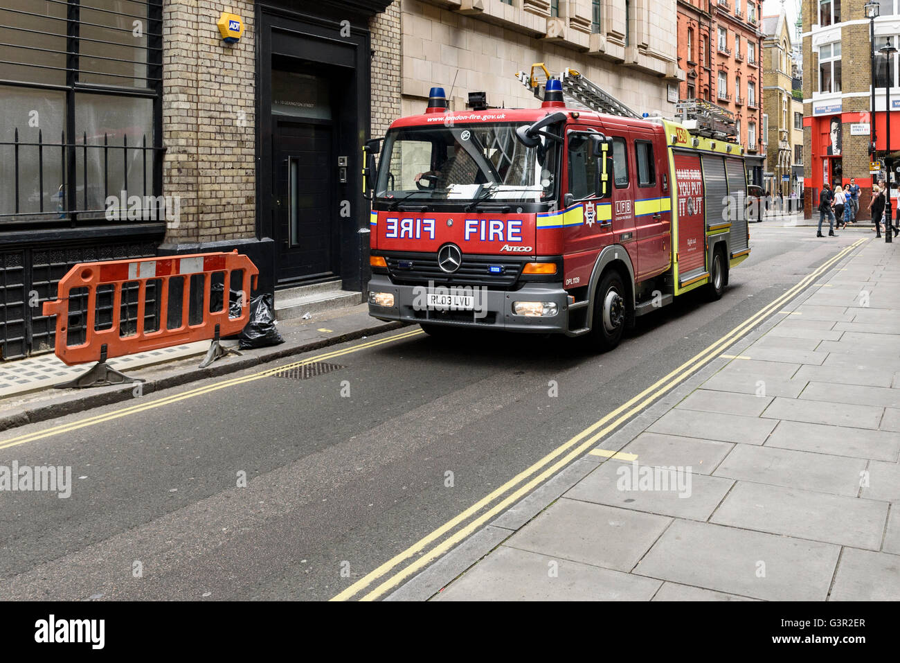 London fire engine on narrow Soho street, UK. Stock Photo