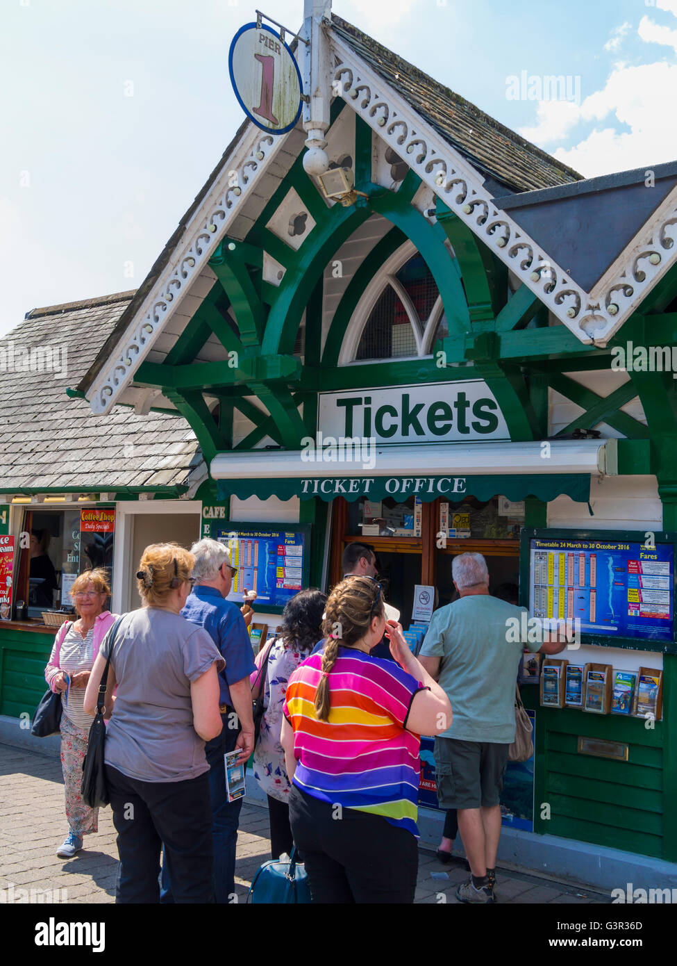 A busy scene at the ticket office for lake cruises at Bo'ness Lake Windermere Cumbria Stock