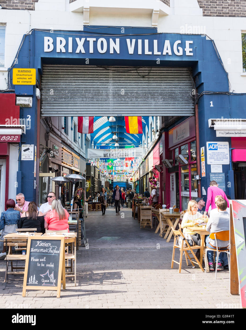 Entrance of the Brixton Village Market, a multicultural community market with independent shops and ethnic restaurants Stock Photo